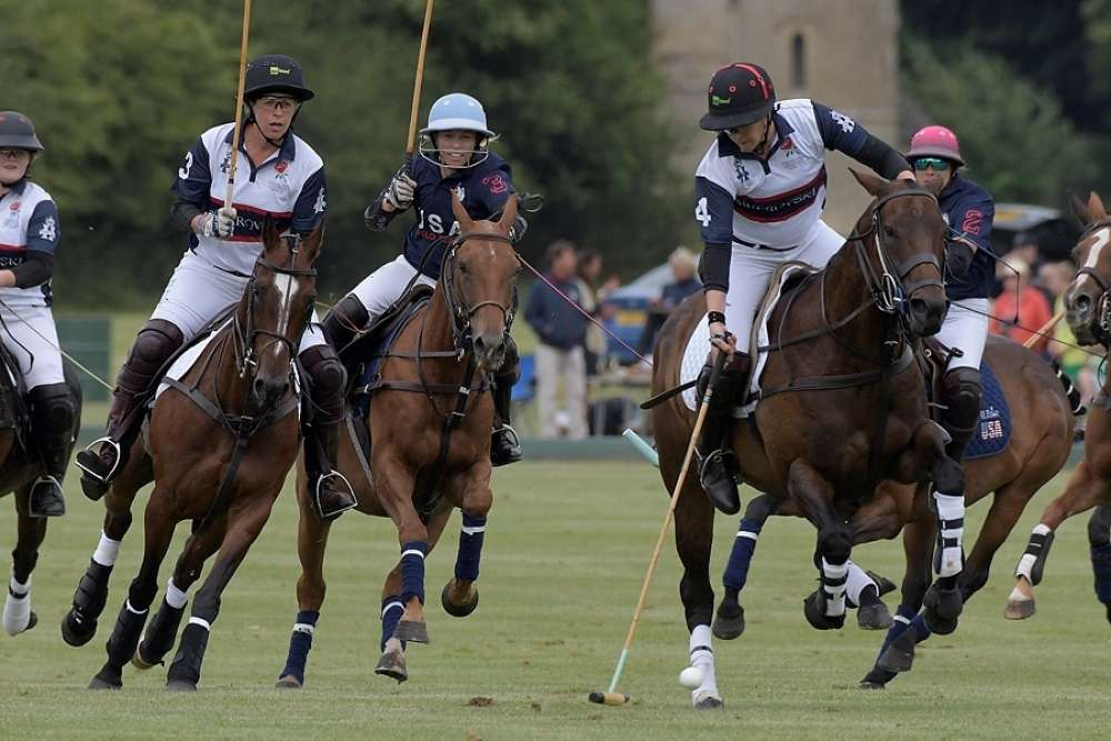 England’s Nina Clarkin on the ball, Tamara Fox and KC Krueger close behind. ©Tom Reynolds