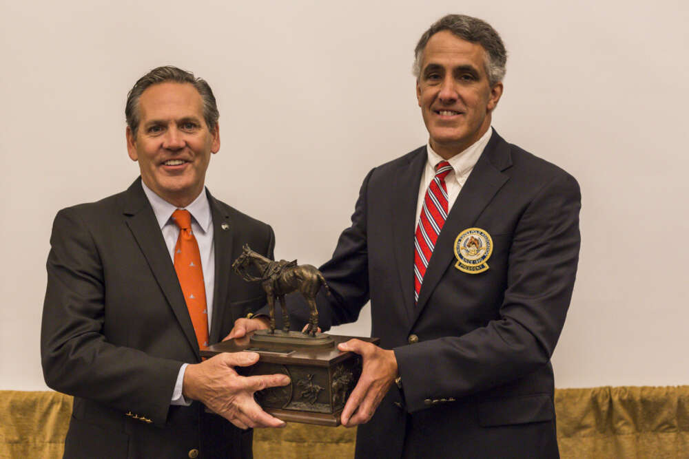 Chip Campbell presents Joseph Meyer with a bronze thanking him for his service as Chairman.