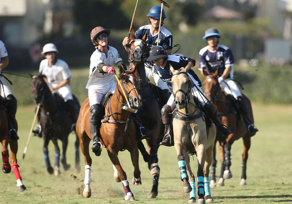 Rancho Polo/Chogan's Jason Crowder extending for the ball in front of Klentner Ranch's Dominique Mielle.