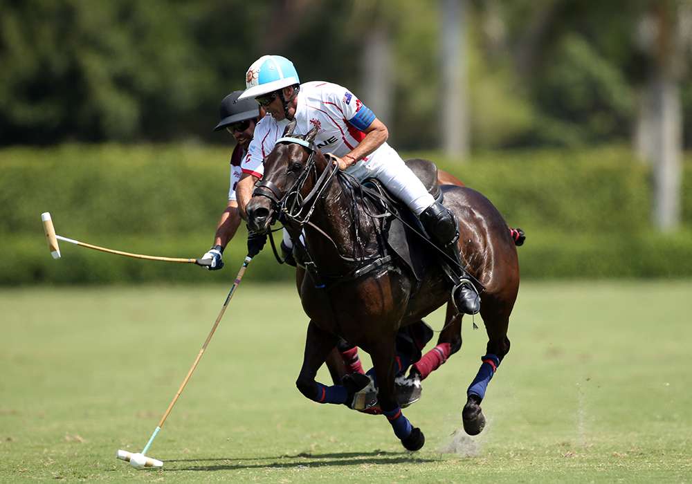 2021 GAUNTLET OF POLO® champion Scone's Adolfo Cambiaso carrying the ball just ahead of Pilot's Facundo Pieres at International Polo Club in Wellington, Florida.