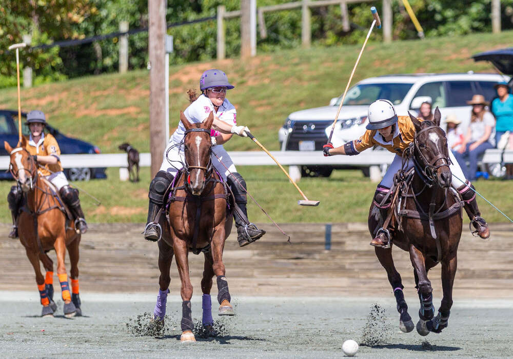 Bad Ass Polo's Demitra Hajimihalis attempts to block the shot from La Jefa's Katie Mitcham.
