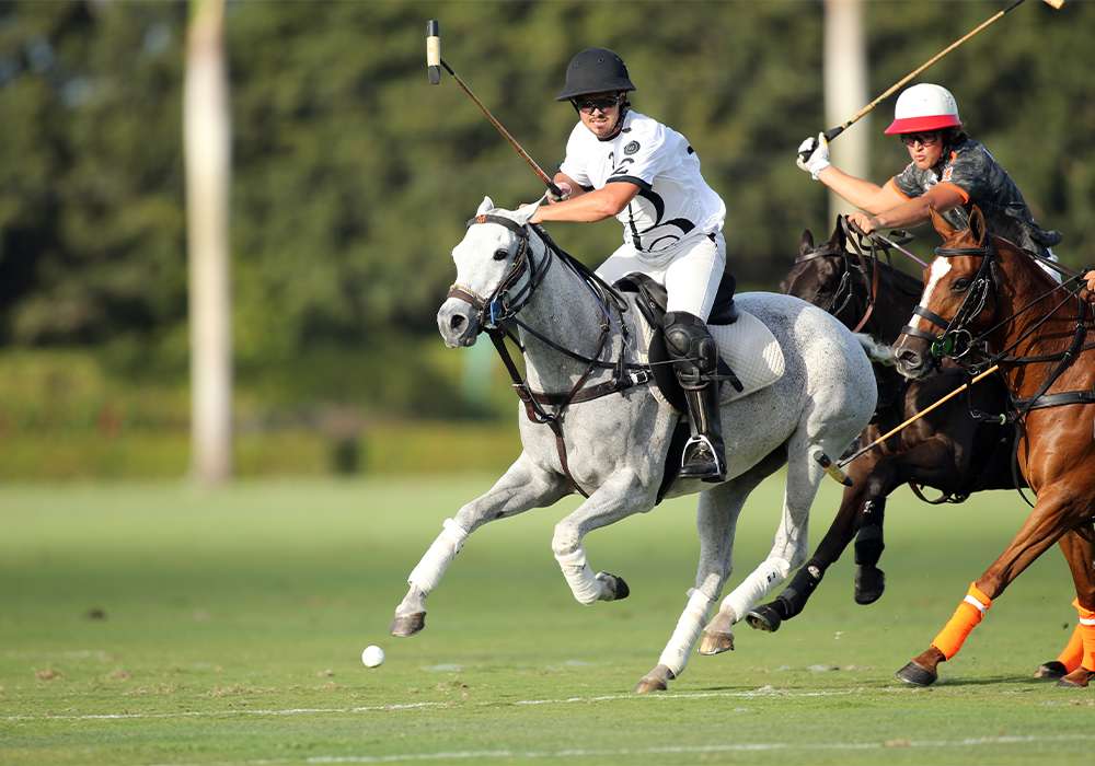 Beverly Polo's Lucas Diaz Alberdi keeps his eyes locked on the ball with La Fe's Lucas Escobar in close pursuit.