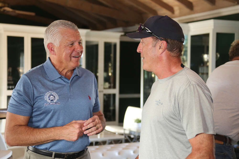 Bob Delaney speaking with Club President and Lucchese team owner John Muse.