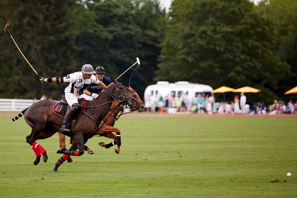 Postage Stamp Farm's Brandon Phillips takes the ball down field with Airstream's Tomas Garcia del Rio on his hip.