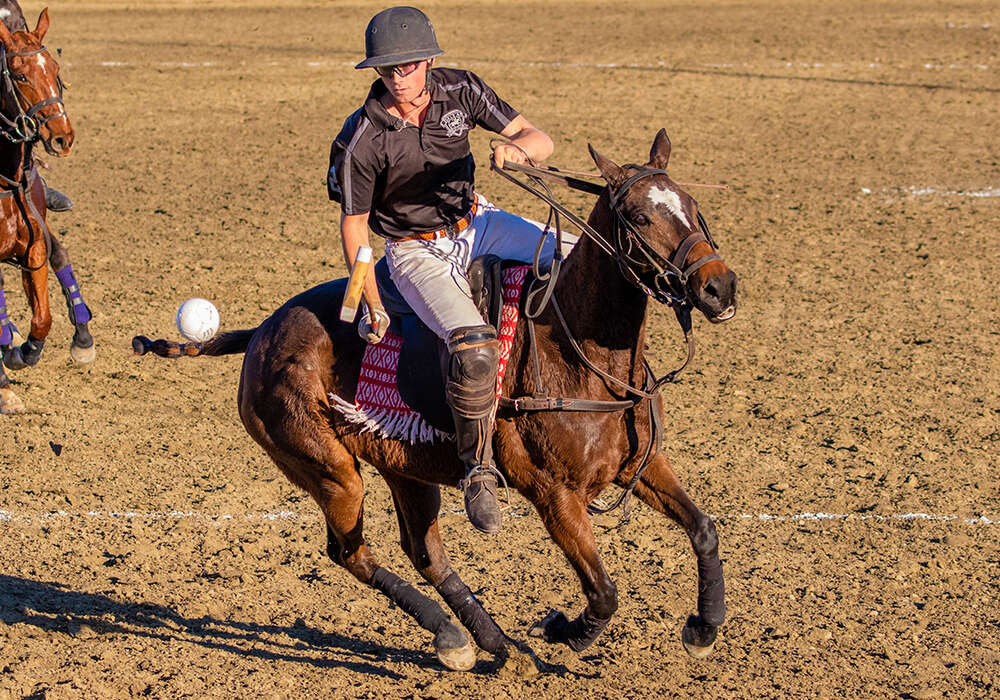 Dallas Polo's Will Walton keeps his eyes locked on the ball in mid-air.