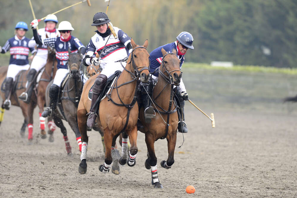 USA's Pelon Escapite takes the ball on the nearside with England's Sebastian Dawnay on his hip. 