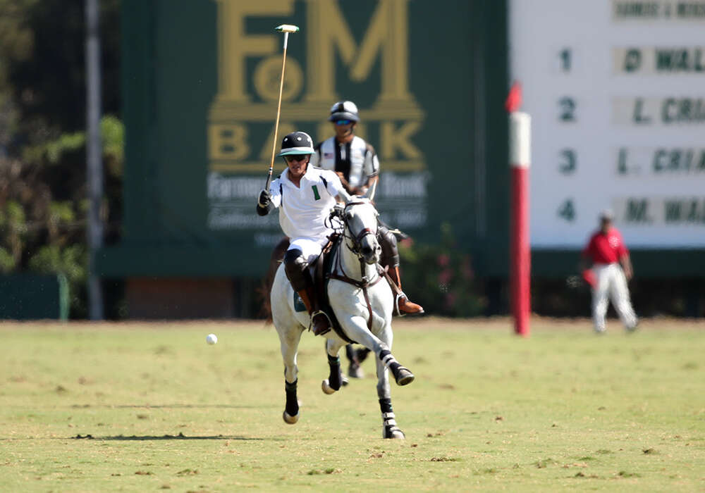 Farmers & Merchants Banks' Daniel Walker with a play on the ball. ©David Lominska