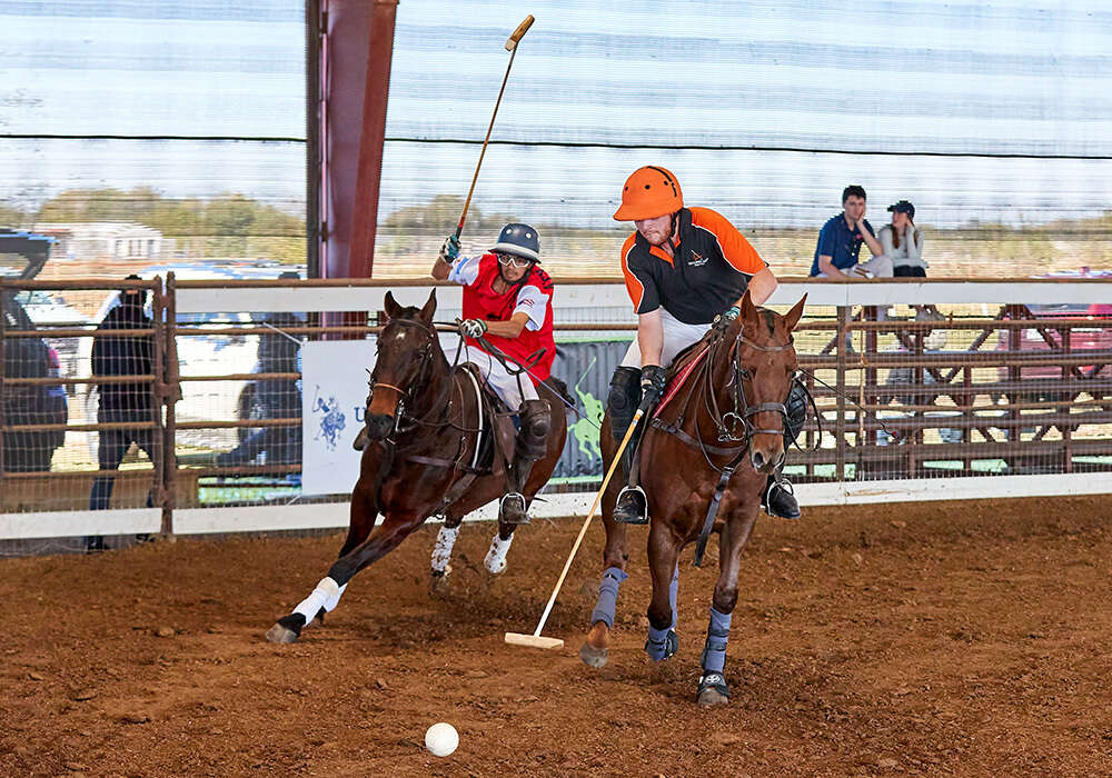 GET It Done's James Glew stretches for possession ahead of JD Boss Polo's Rehan Kumble.