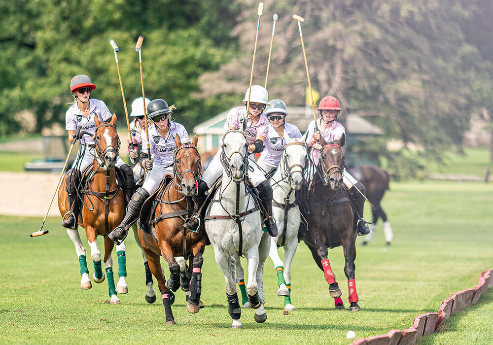 Girls' Purple Summer Kneece and Girls' Pink Madison Jordan lead their respective teams towards the ball. ©Kaile Roos