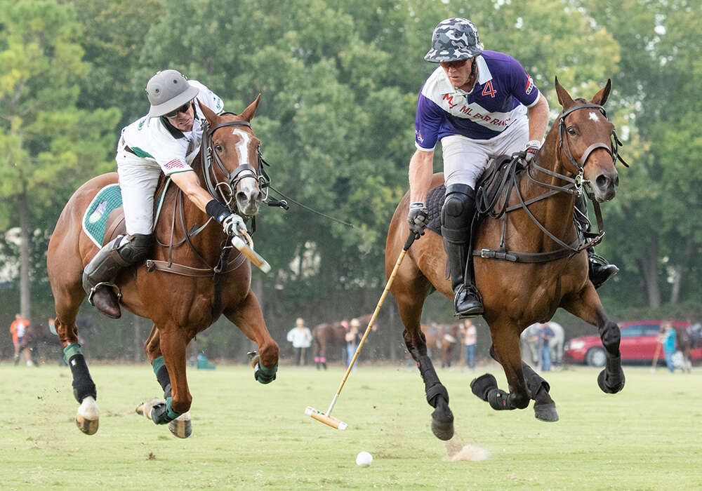 Horsegate/Tonkawa's Jimmy Seward attempts a hook on ML Bar Ranch's Joe Wayne Barry.