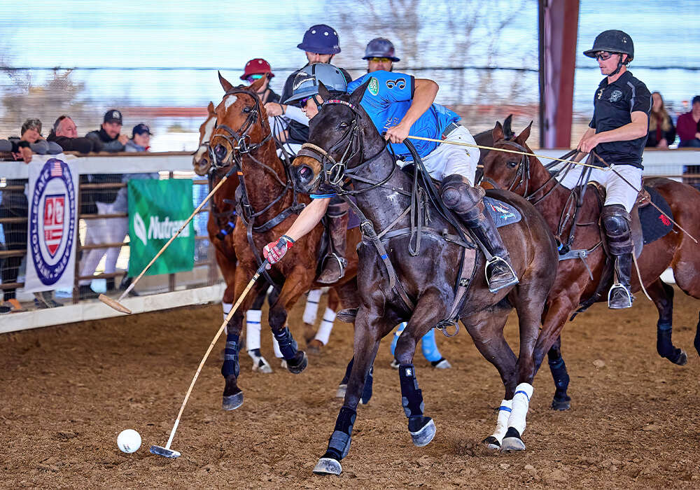 Horsegate's Lance Stefanakis reaches for the play ahead of Dallas Polo's Mike Farah.