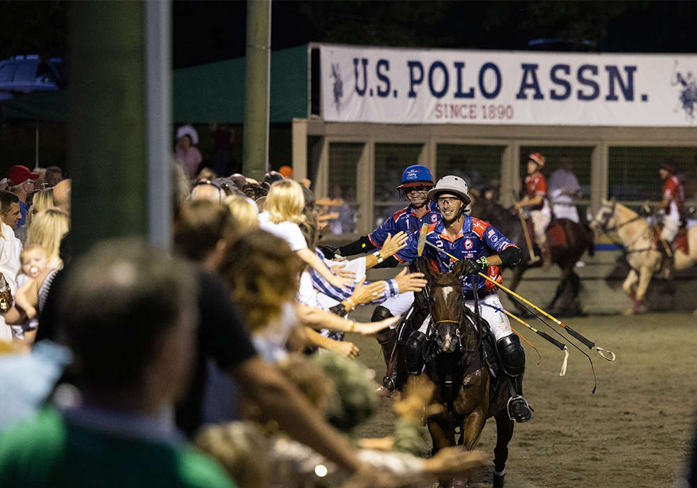 Tolito Fernandez Ocampo and Tareq Salahi celebrate with the excited crowd at Twilight Polo Club.