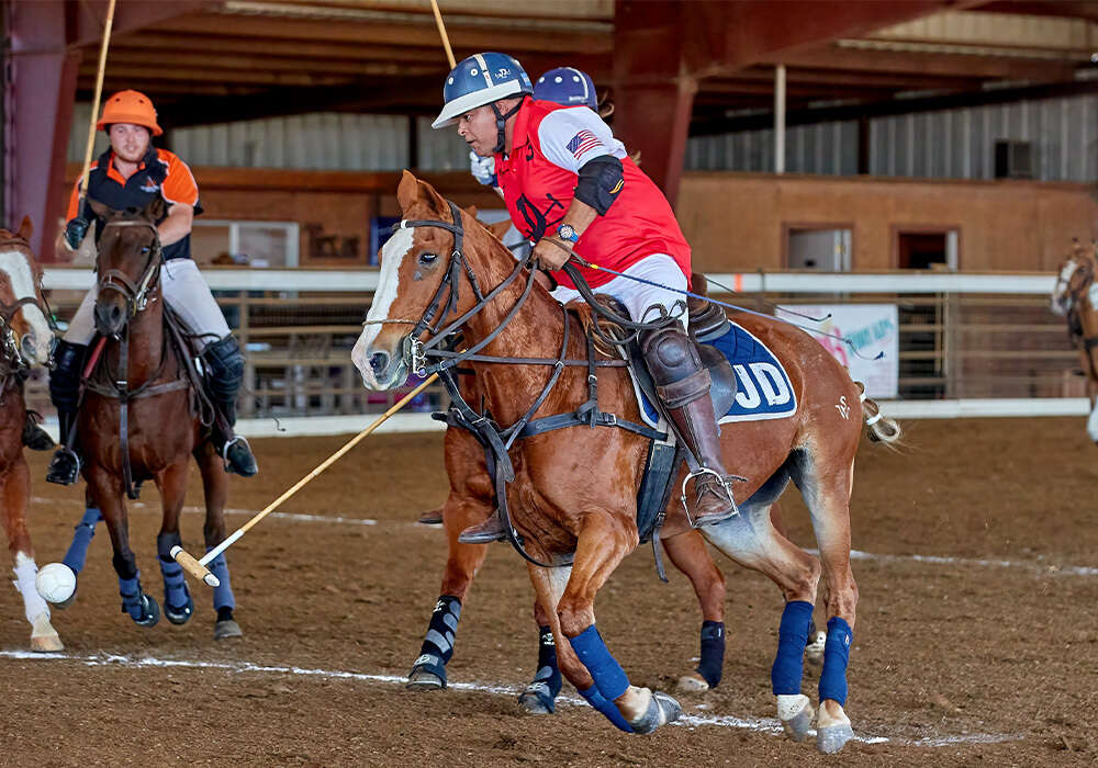 JD Boss Polo's Javier Insua turns on the ball.