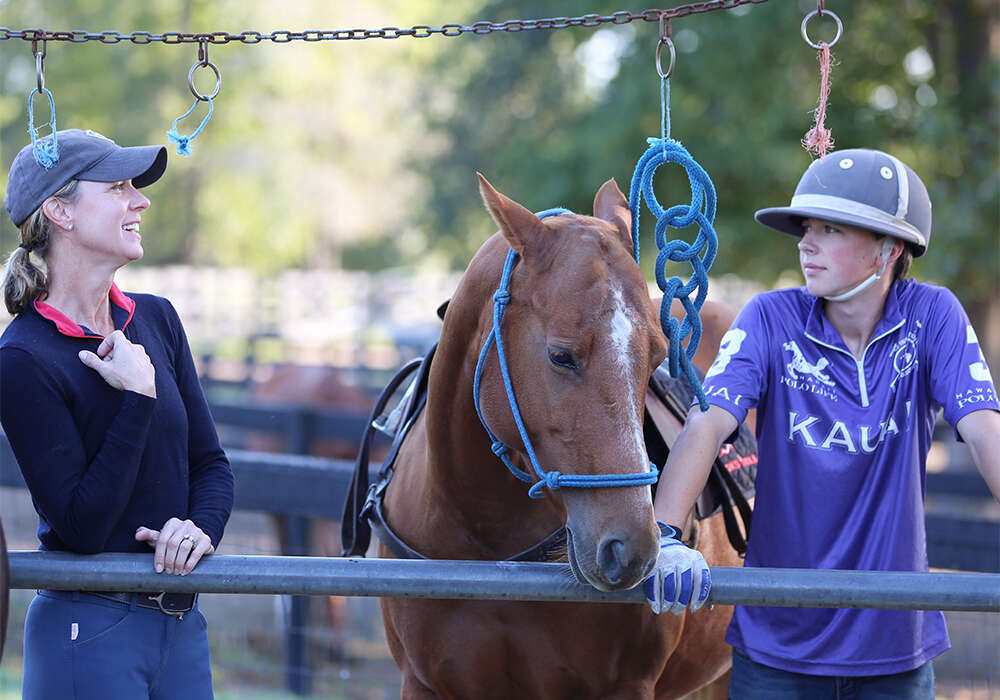 Whitman (with mother Michelle) credits his success and growth in polo to his family and support system. ©Keith Whitman