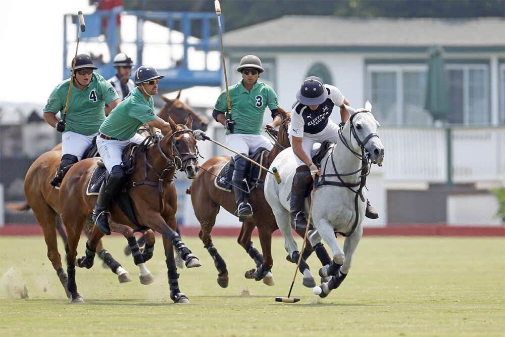Jesse Bray carries the ball away from Farmers & Merchants Bank during 2018 Silver Air Pacific Coast Open bracket play. ©David Lominska.