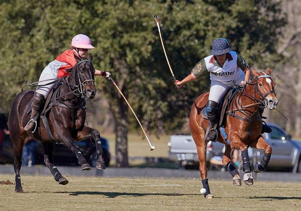 Ketel One Botanical's Joanie Jackson races forward on Best Playing Pony Amateur Montana as T Squared Energy's Emma Tooth. stretches to block.