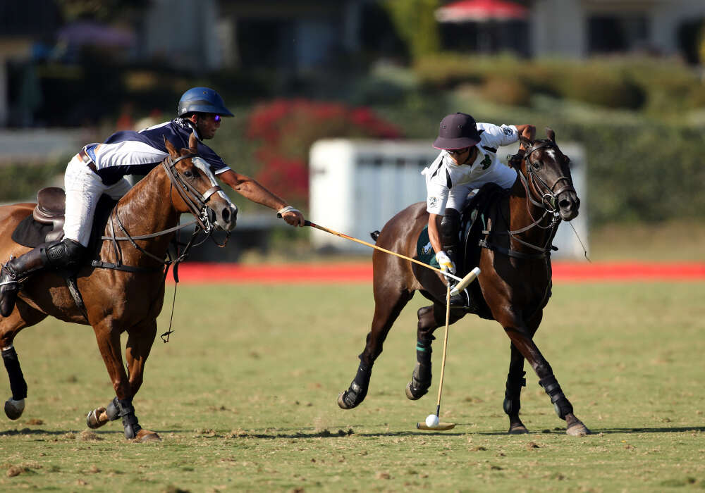 Klentner Ranch's Jake Klentner reaches for the hook Farmers & Merchants Banks' Lucas Criado Jr. ©David Lominska