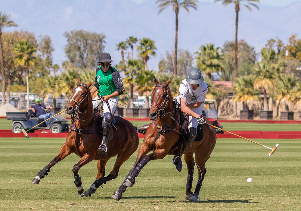 Luna Polo's Diego Larregli on defense as Exit Consulting's Ashton Wolf carries the ball on the nearside.