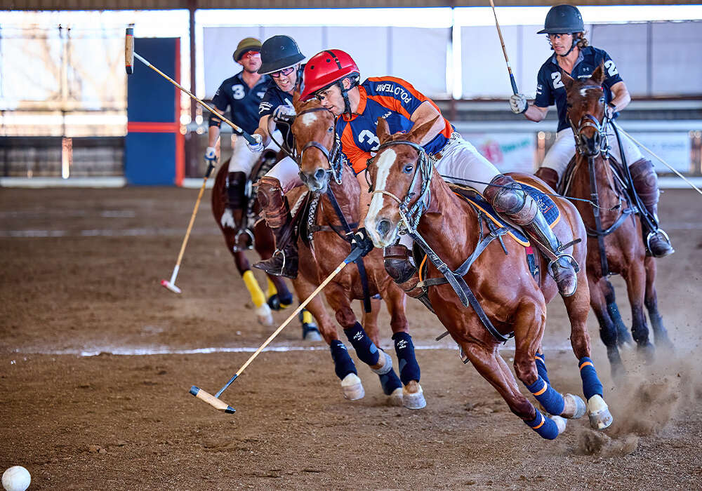 Legends' August Scherer turns to the ball ahead of Bar-Spur's Mark Osburn.