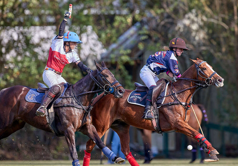 Rocking P's Mili Sanchez charges to the goal on Professional Best Playing Pony London ahead of Engel & Volkers Houston's KC Krueger.