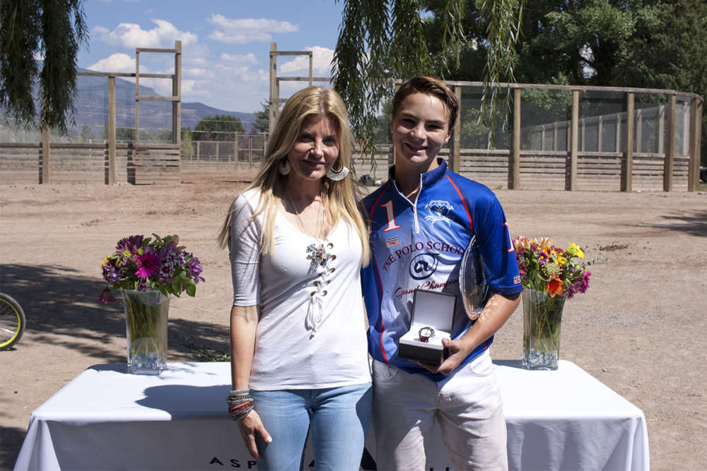 Tournament MVP Aiden Meeker with awards presenter Olexa Celine and his MVP watch.