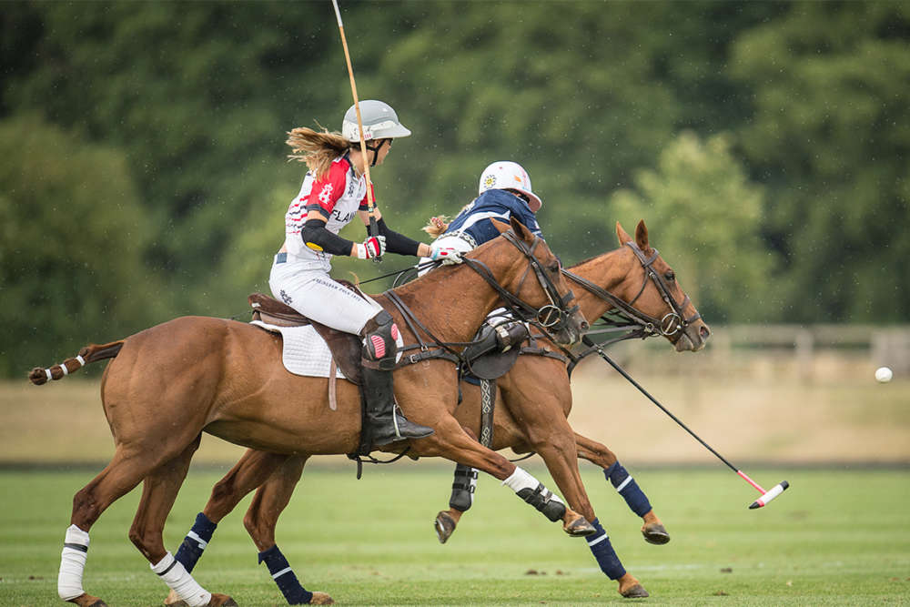Girl power: USA's Hope Arellano carries the ball on the nearside, England's Milly Hine in pursuit. 