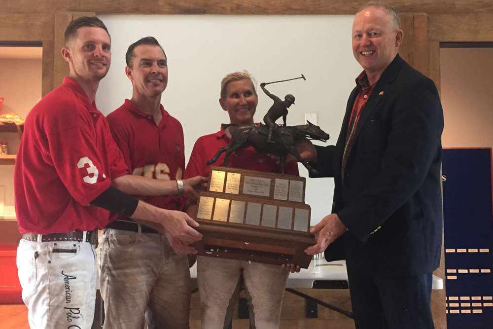 Victorious Marines capture a place on the perennial trophy - Chris Jones, Jake Flournoy and Shannon McGraw with event organizer Steve Walsh.