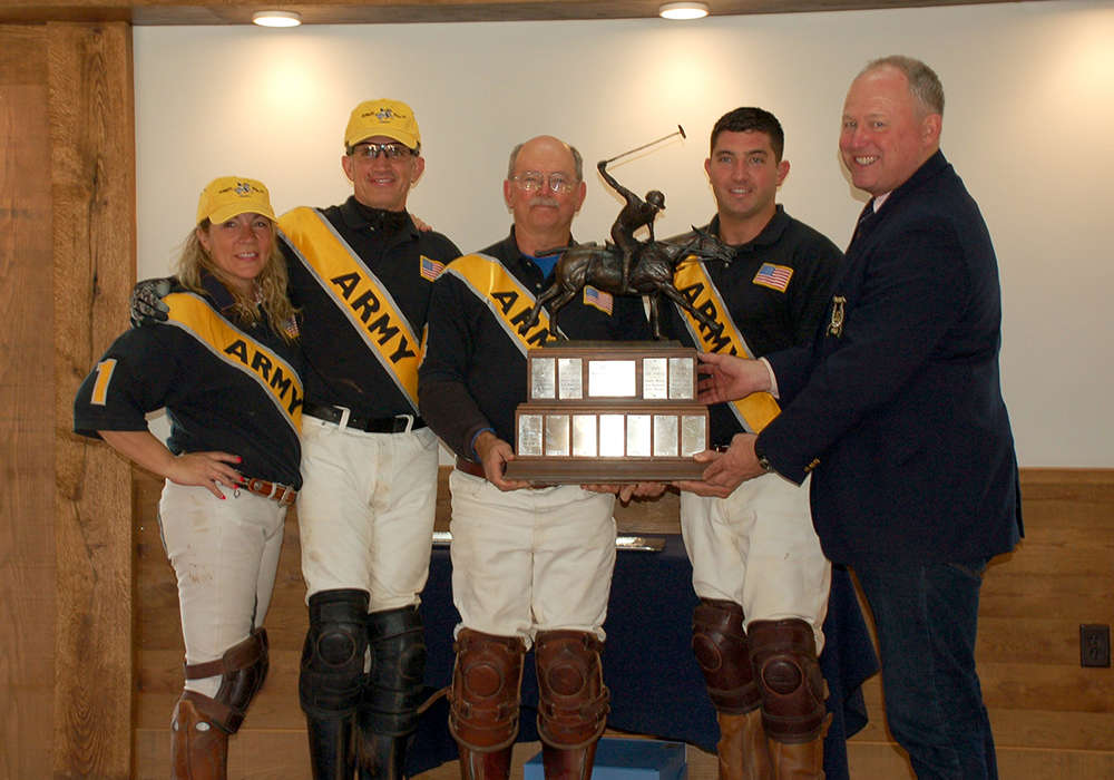 Mark Gillespie pictured center, winning the 2016 Nimitz Cup with Army.