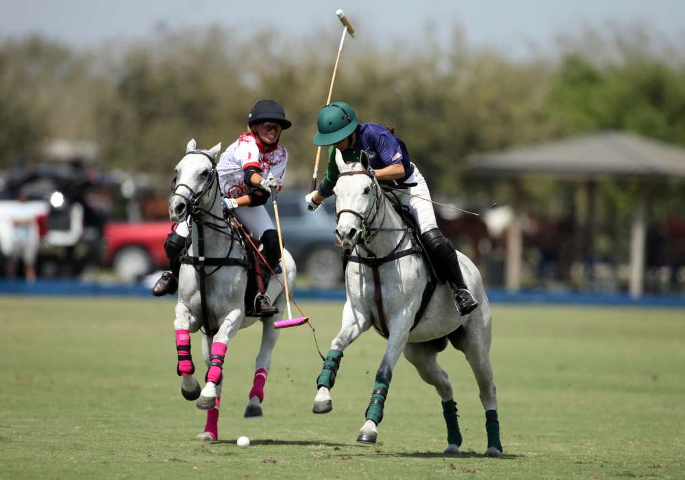 G-String Polo Ponies' Heather Souto attempts to hook BTA-The Villages' Paige Boone. ©David Lominska