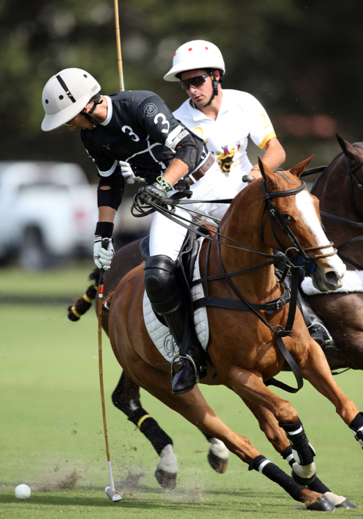 Beverly Polo's Jorge "Tolito" Fernandez Ocampo. Jr. turns on the ball ahead of CK Shack's Kristos "Keko" Magrini.