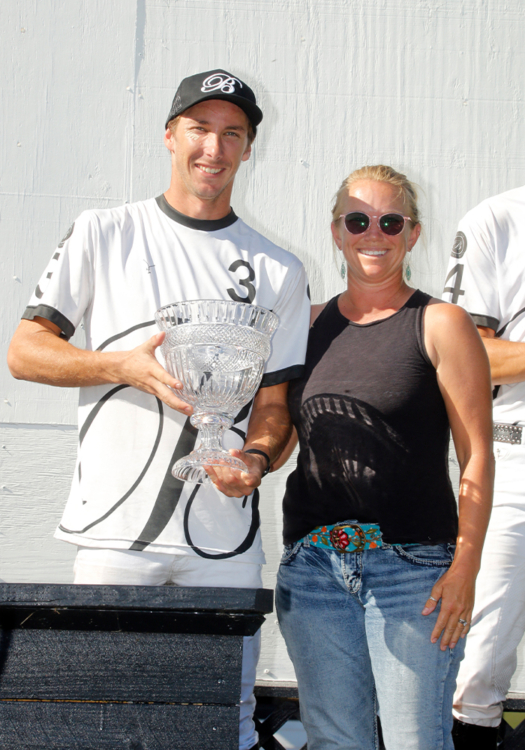 Most Valuable Player Jorge "Tolito" Ocampo Jr, presented by Port Mayaca Polo Club Manager Laura Linfoot Townsend.