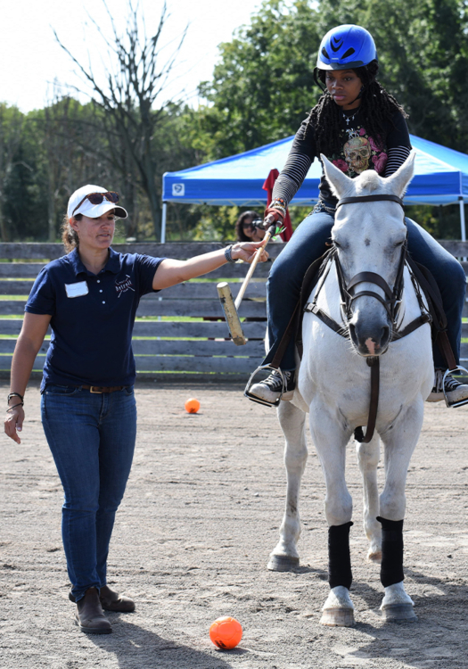 Students who felt comfortable riding were assigned a pilot and a horse to help get the feel of hitting the ball while mounted.