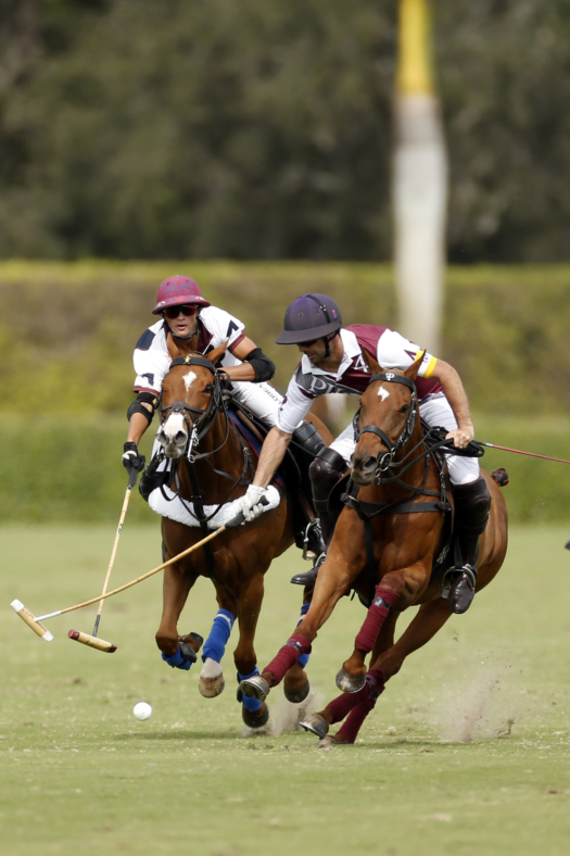Dutta Corp's Timmy Dutta reaches for the hook on Pilot's Facundo Pieres.