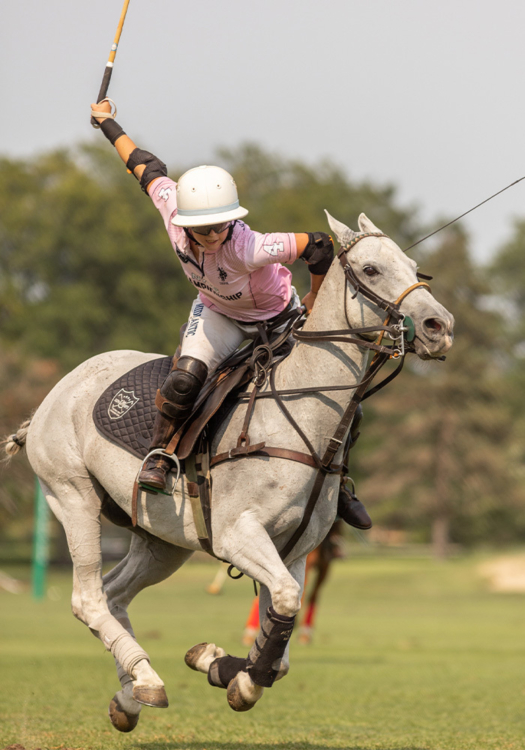Girls' Pink Madison Jordan attempting a forehand shot was awarded the Horsemanship Award. ©Kaile Roos