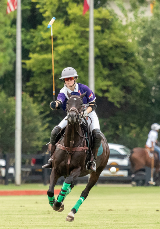 ML Bar Ranch's Abby Benton takes the ball in flight on a breakaway.