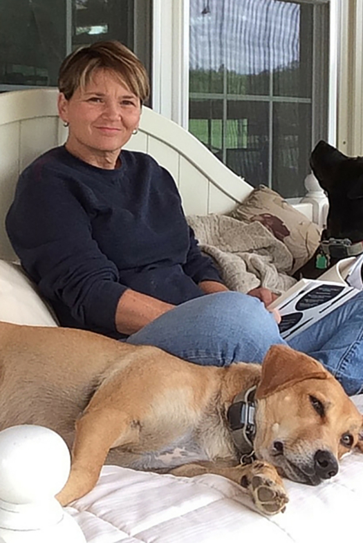 Kim relaxing with her dogs